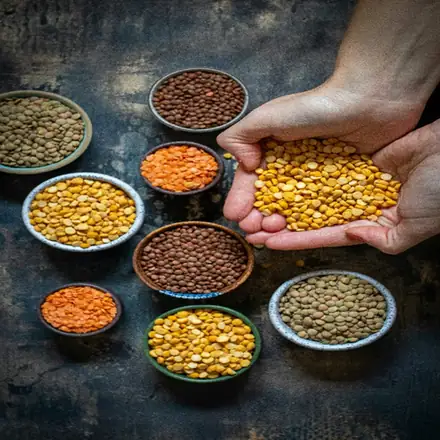 Assorted lentils and split pulses in bowls