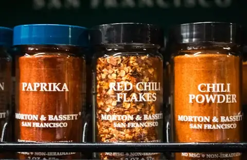 Retail spice jars on a shelf as an example of retail packs